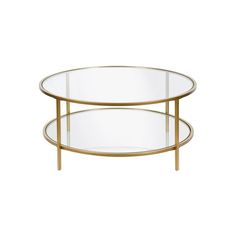 an oval glass table with two metal legs and a gold frame around the edge, against a white background