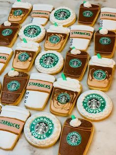 starbucks cookies and cupcakes are arranged on a table