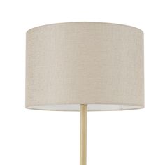 a white lamp with a beige shade on the base and a wooden stick underneath it