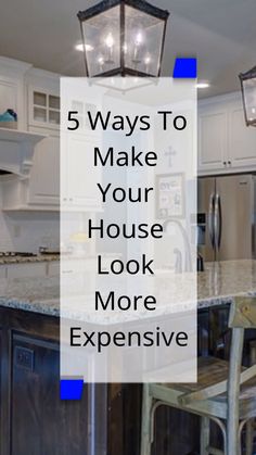 a kitchen with white cabinets and an island in the middle that says 5 ways to make your house look more expensive