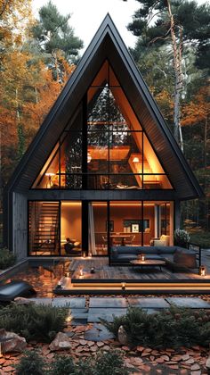 a large house with lots of windows in the middle of it's roof and patio area