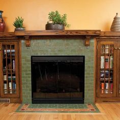 a living room with a fire place and bookshelves