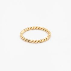 The subtle perfection of this braided band could only come from the careful handicraft that exemplifies Single Stone's approach to design. Made entirely to order, the whimsical texture of this piece is a perfect contrast to a stack of diamond bands or as a subtle complement to a traditional solitaire. Made in the U.S.A. Measures 2 mm wide. Size 6 in stock now. All sizes available by special order in 4-6 weeks. To inquire, including alternate metal options, please contact us. 18 karat gold. 1000 Gifts, Single Stone, Diamond Bands, Rope Bracelet, Wedding Bands, Gold Bracelet, Fine Jewelry, Gift Card, Band