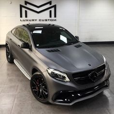 a mercedes cla is parked in a showroom