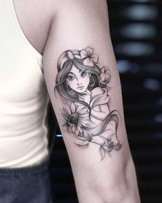 a woman's arm with a flower tattoo on the left side of her body