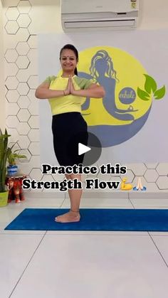 a woman standing on a yoga mat in front of a wall with the words practice this strength flow