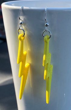 "Lightning Bolt Earrings Yellow Acrylic Flash of Lightning Earrings  It's electric!  It's shocking! Earrings are inspired by the boy who lived and his wizard scar. Or the fastest man alive that leaves a flash of lightning behind him when he runs.   They also remind me of the 80s punk and glam rock music scene. Great for cosplay, costumes, every day wear or channeling your inner rocker.  They also make a great gift! You will receive 1 pair of acrylic yellow lightning bolt charms that are attached Glam Rock Music, Lightning Earrings, Yellow Lightning, Bolt Earrings, 80s Punk, Lightning Bolt Earrings, Fastest Man, Hypoallergenic Earrings, Glam Rock