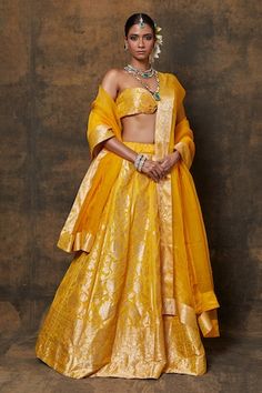 Yellow banarasi silk lehenga with woven zari floral jaal motifs. Comes with dupatta and unstitched blouse fabric. - Aza Fashions Cotton Silk Traditional Wear With Zari Weaving For Reception, Cotton Silk Lehenga For Diwali Reception, Cotton Silk Lehenga For Reception And Diwali, Gold Cotton Silk Sharara With Pallu, Yellow Anarkali Lehenga In Cotton Silk, Transitional Lehenga With Zari Work, Transitional Cotton Silk Lehenga With Zari Work, Silk Sets With Zari Weaving For Reception, Transitional Season Wedding Cotton Silk Choli