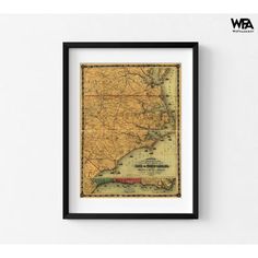 an old map of the state of new york in black frame on a white wall