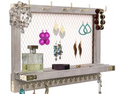 a shelf that has some jewelry on it