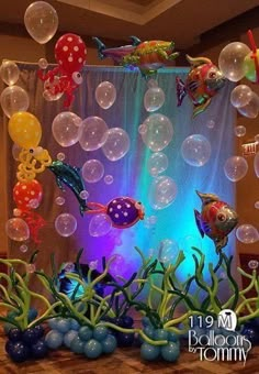 an aquarium themed birthday party with balloons and fish