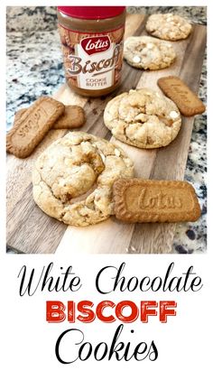 white chocolate biscoff cookies on a wooden cutting board with a jar of biscuits in the background