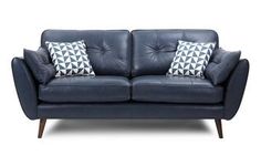 a blue leather couch with two pillows on it