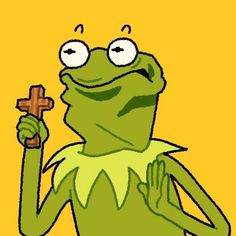 kermie the frog holding a cross in his hand