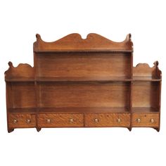 an old wooden shelf with drawers on it