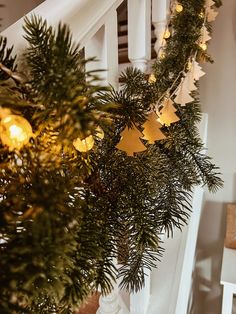 christmas garland with lights hanging from the banister