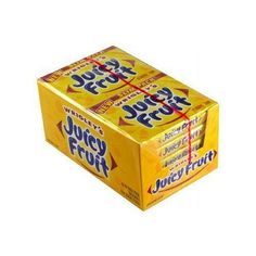 juicy fruit gummy bars are stacked on top of each other in a yellow box