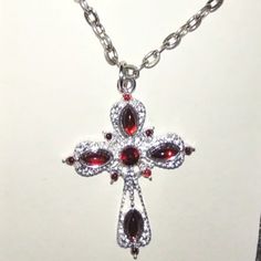 Sterling Silver Filled Chain Holding A Cross Pendant With Red Garnet Crystals. Silvertone Cross Measures 2"L. Chain Is 18 Inches Plus A 1-In Extender Chain. New On Card. Red Cross Necklace, Dream Things, Fall Stuff, Garnet Crystal, Crystal Cross, Pretty Jewelry, Cross Jewelry, Red Crystals, Red Cross