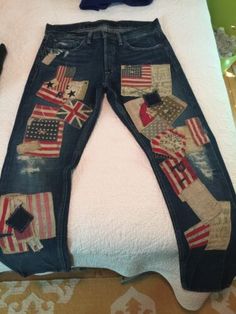 a pair of jeans with american flags on them