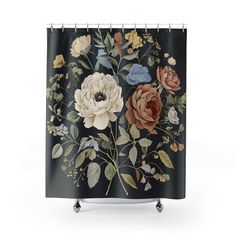 a shower curtain with flowers and leaves painted on the front, along with black background