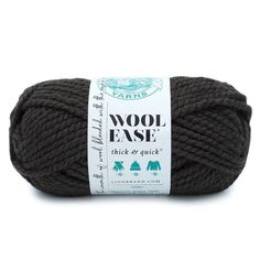 wool ease thick & quick yarn ball in dark grey, with white label on top