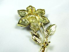 "Beautiful vintage brooch . I bought this pin from an older lady who said she had it since the 1950-60s. Set in gold tone metal are beautiful flower petals of amethyst colored rhinestones and a beautiful iridescent turquoise around the center.perfect condition. Very good quality. Size is 2\"wide x 2.5\" tall. Beautiful! One of my favorite." Vintage Gold Enamel Pin For Wedding, Gold Vintage Enamel Pin For Wedding, Collectible Gold Flower Enamel Pin, 1950s Jewelry, Amethyst Color, Brooch Vintage, Vintage Brooch, Who Said, Beautiful Flower