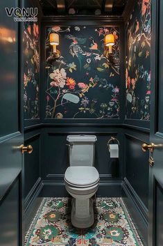 a bathroom with floral wallpaper and blue walls