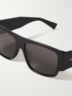 Bottega Veneta Eyewear's sunglasses have been made in Italy from thick black acetate. They're accented with the moniker and gold-tone triangles along the wide arms and fitted with tonal square lenses. Acetate Sunglasses, Cycling Accessories, Sunglasses For Men, Square Frame, Luxury Gifts, Suede Jacket, Square Frames, Weekender Bag, Eyewear Sunglasses