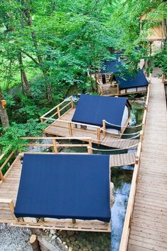 there are many boats that are on the dock in the water, and one is blue