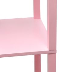 a pink table with two shelves on each side