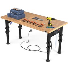 a workbench with tools on it sitting on a wooden table next to a tool box