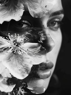 a woman with flowers on her face