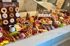 a table filled with lots of different types of food and pastries on it's sides