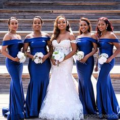 the bride and her bridesmaids pose for a photo