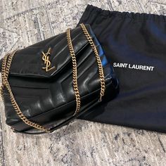 Saint Laurent Shoulder Bag In Overstitched Y-Quilted Calf Leather. Sliding Chain And Leather Shoulder Strap May Be Doubled; Folded, 11.8" Drop And Unfolded, 22" Drop. Golden Metal Hardware. Envelope Flap With Ysl Logo; Snap Closure. Center Zip Pocket Divides Interior; One Slip Pocket. Grosgrain Lining. 6.6"H X 9.8"W X 3.5"D. Approx. Weight 2.1 Lb. Made In Italy. This Was A Gift And I Realized Just Not Meant For Me. I Hope It Finds A Home For Someone That Will Use It Endlessly. It’s A Beautiful B Loulou Ysl Bag, Ysl Shoulder Bag, Ysl Bags, Ysl Logo, Yves Saint Laurent Bags, Quilted Leather, Metal Hardware, Beautiful Bags, Ysl Bag