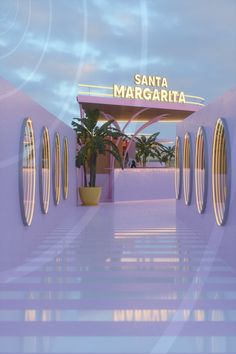 an entrance to the santa margarita hotel with palm trees