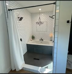 a bath room with a tub a sink and a mirror on the wall in it