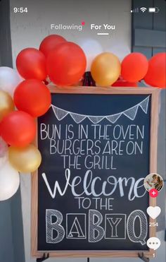 a sign that says bun is in the oven, burgers are on the grill, welcome to the babyo