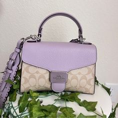 Signature Coated Canvas And Refined Pebble Leather Inside Multifunction Pocket Snap Closure, Fabric Lining Top Handle With 2 3/4" Drop Outside Open Pocket Detachable Strap With 22 1/2" Drop For Shoulder Or Crossbody Wear 8 3/4" (L) X 6" (H) X 4" (W) Style No. Ca233 Coach Purple Shoulder Bag With Top Carry Handle, Coach Purple Bag With Top Carry Handle, Coach Purple Bag With Adjustable Strap, Purple Double Handle Shoulder Bag With Detachable Strap, Purple Shoulder Bag With Detachable Double Handle, Coach Rectangular Purple Shoulder Bag, Coach Purple Rectangular Shoulder Bag, Rectangular Purple Coach Shoulder Bag, Coach Purple Bag With Detachable Handle