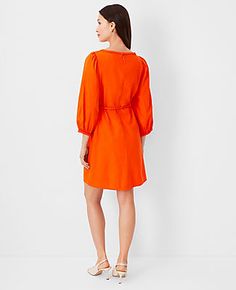 Elevate your wardrobe with the Ann Taylor Linen Blend Puff Sleeve Belted Shift Dress, a perfect blend of elegance and comfort. This dress features a sophisticated boatneck, charming 3/4 puff sleeves with shirred caps, and a flattering self-tie waist that accentuates your silhouette. The hidden back zipper ensures a seamless fit, while the above-the-knee length offers a modern appeal.

- Size: Regular 8
- Color: Flame Azalea
- Material: Shell - 55% Linen, 45% Viscose; Lining - 100% Cotton
- Gende Spring Workwear Belted Puff Sleeve Dress, Spring Dresses With Tie Waist And 3/4 Sleeve, Summer Knee-length Linen Puff Sleeve Dress, Red Linen Short Sleeve Dress, Flame Azalea, Orange 3/4 Sleeve Summer Dress, Red Linen Knee-length Dress, Pink Short-sleeved Linen Dress, Azalea Color