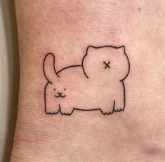 a small cat tattoo on the ankle that looks like it has been drawn in black ink