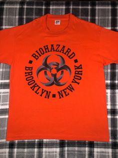 Biohazard - Vintage 90s - Hardcore Metal Rock Band Single Stitch T Shirt - Size XL Good preowned condition. Light wear and fading. There is a tiny mark on the back of the shirt. Please refer to the photos 90s Brooklyn, Biohazard Band, Punk Band Shirts, Band Merch Washed T-shirt For Streetwear, Retro Orange T-shirt For Streetwear, Band Merch Acid Wash Relaxed Fit T-shirt, Orange Retro Streetwear T-shirt, Punk T-shirt With Band Logo, Stitch T Shirt