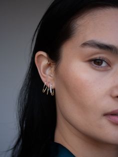 Style is in the details. Minimalist in size but maximalist in shine, the Mini Triangle Safety Pin Earring is crafted from 14Kt gold that gleams in the light. Make it your signature everyday piece. 14kt Gold Triangle Safety Pin Earring Available in Yellow or Rose Gold Width: Approx 5mm Length: 17mm Sold as single Made in L.A. Safety Pin Earring, 50th Clothing, Safety Pin Earrings, Gold Triangle, Heel Accessories, Book Candle, Sell Gold, Triangle Shape, Accessories Rings