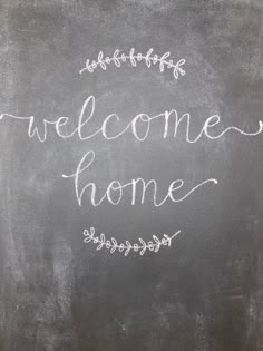 a chalkboard with the words welcome home written on it