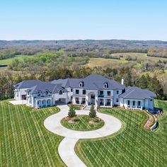 an aerial view of a large home in the countryside