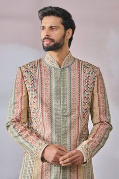 Beige, multi colored printed sherwani highlighted with kasheeda embroidery. Comes with solid kurta and salwar. - Aza Fashions Multicolor Kurta With Intricate Embroidery For Transitional Season, Multicolor Traditional Wear For Eid Ceremonies, Multicolor Embroidered Kurta For Transitional Season, Transitional Multicolor Kurta With Intricate Embroidery, Ceremonial Multicolor Traditional Wear For Transitional Season, Ceremonial Multicolor Traditional Wear For Eid, Ceremonial Embroidered Multicolor Sets, Ceremonial Sherwani With Multicolor Embroidery For Eid, Traditional Sherwani With Multicolor Zari Embroidery