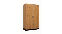 a tall wooden cabinet sitting on top of a white wall