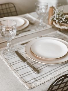 a table set with place settings and silverware