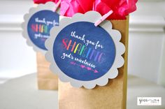 two brown paper bags with thank you for sharing stickers on them