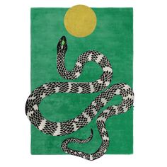 a green rug with a snake on it and the sun in the sky behind it